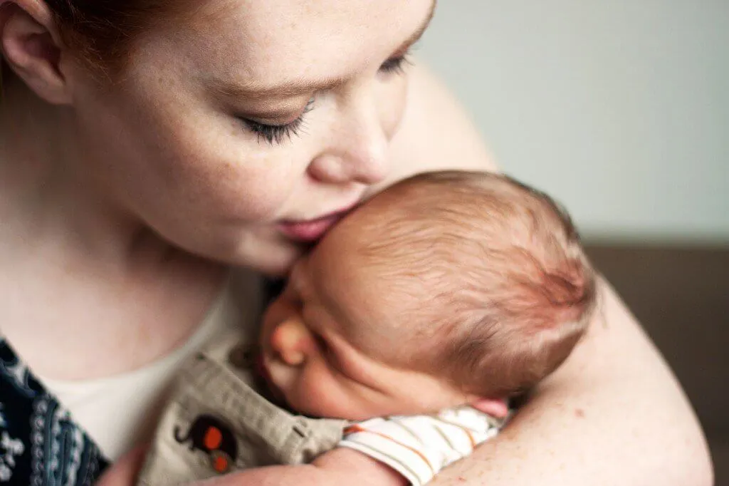 Mother Kissing Baby